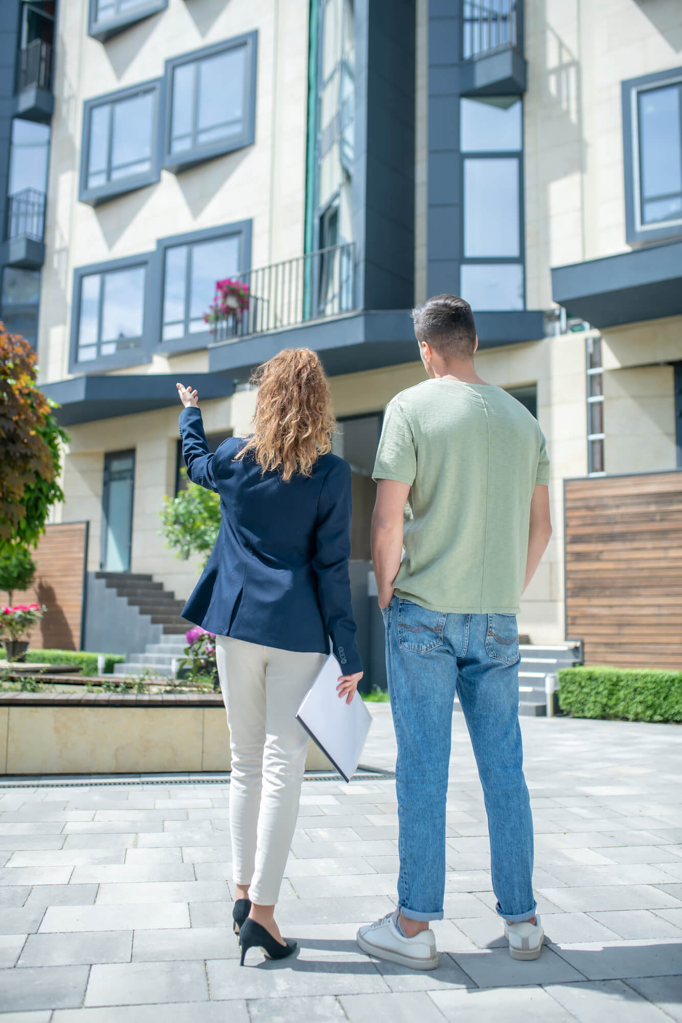 Two people looking at a home for sale in Raleigh