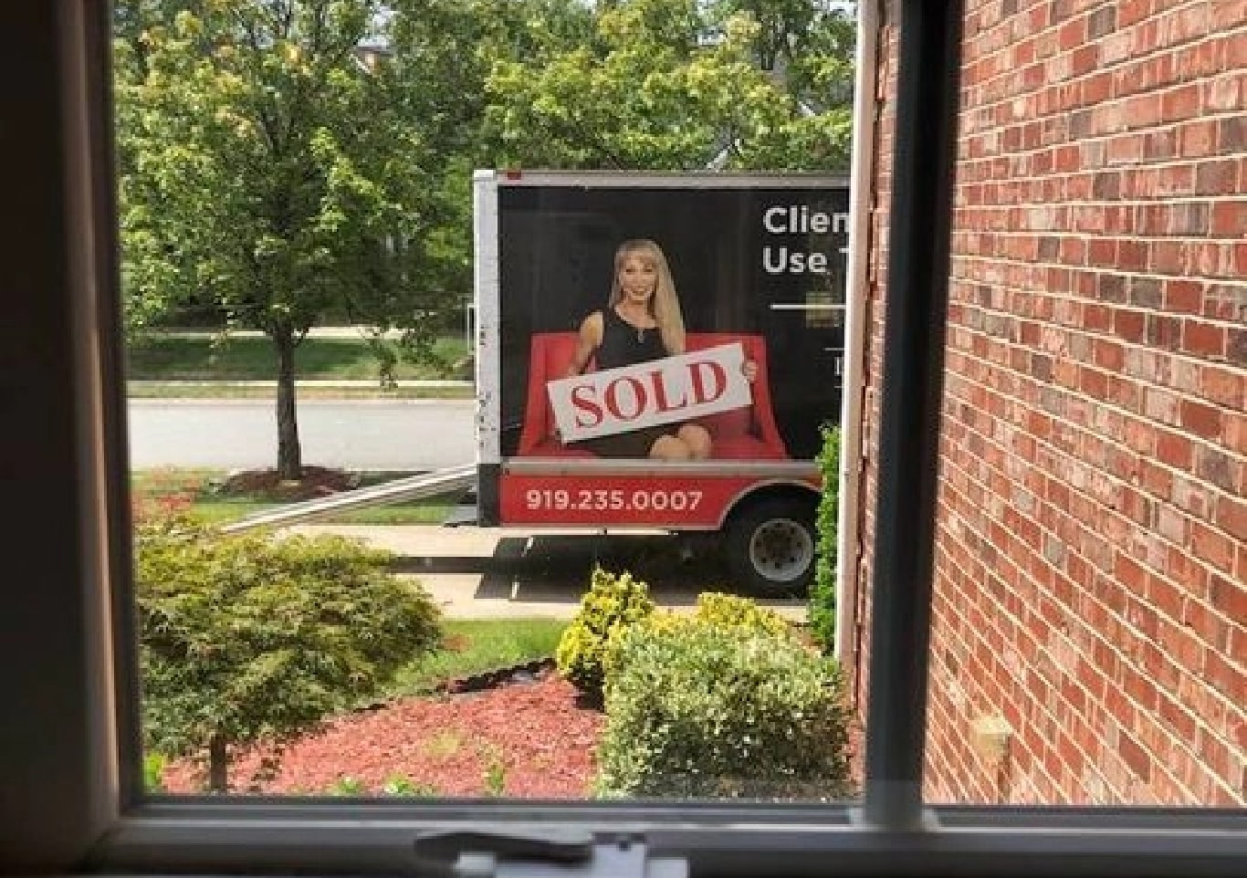 The Linda Craft Team moving truck through the window