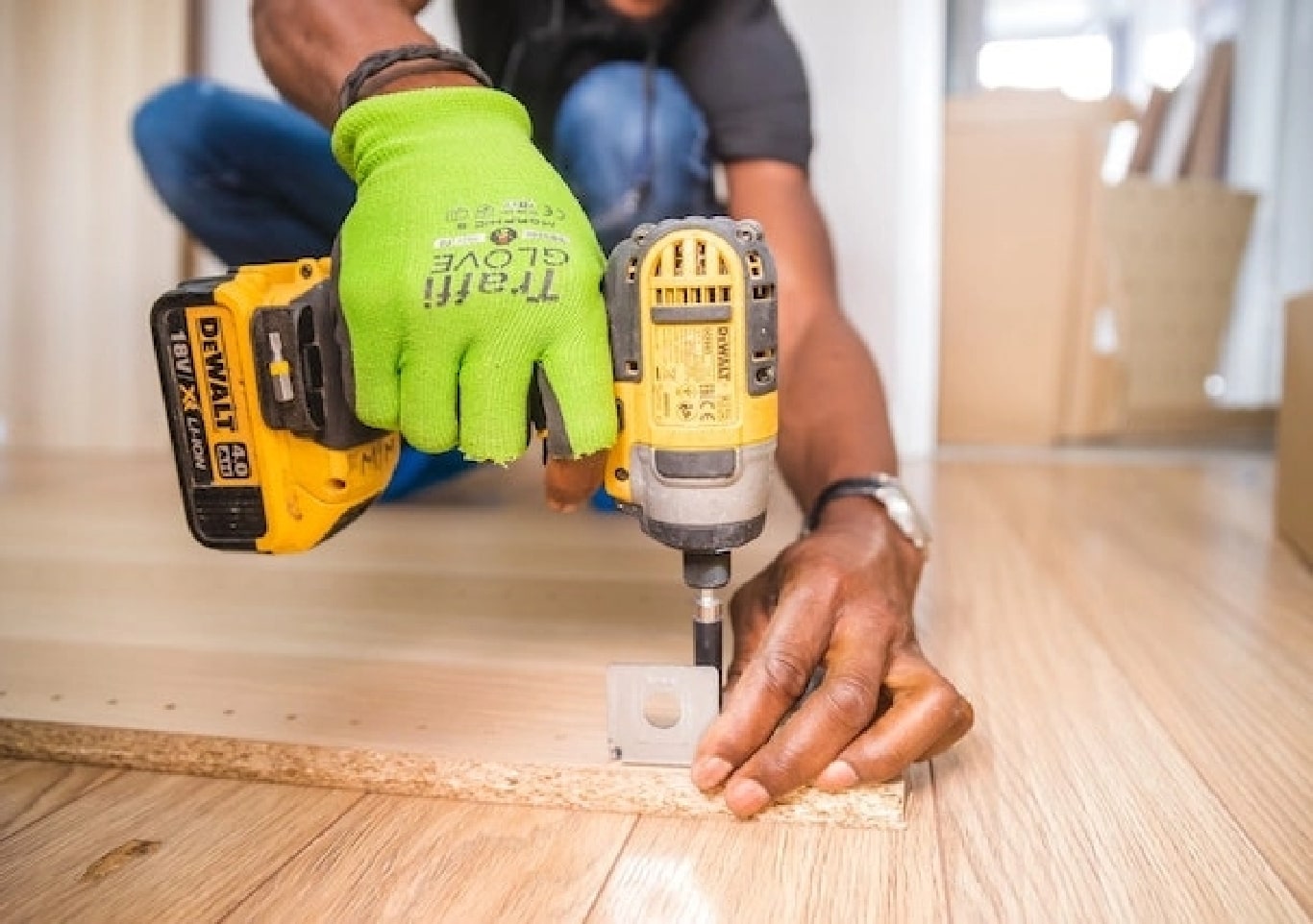 A builder using a drill