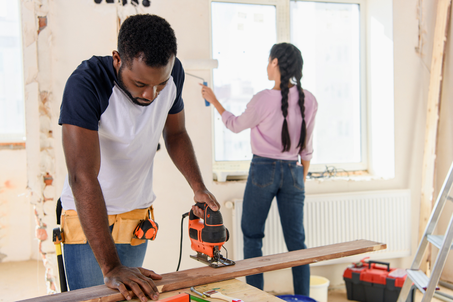 couple doing renovations on home