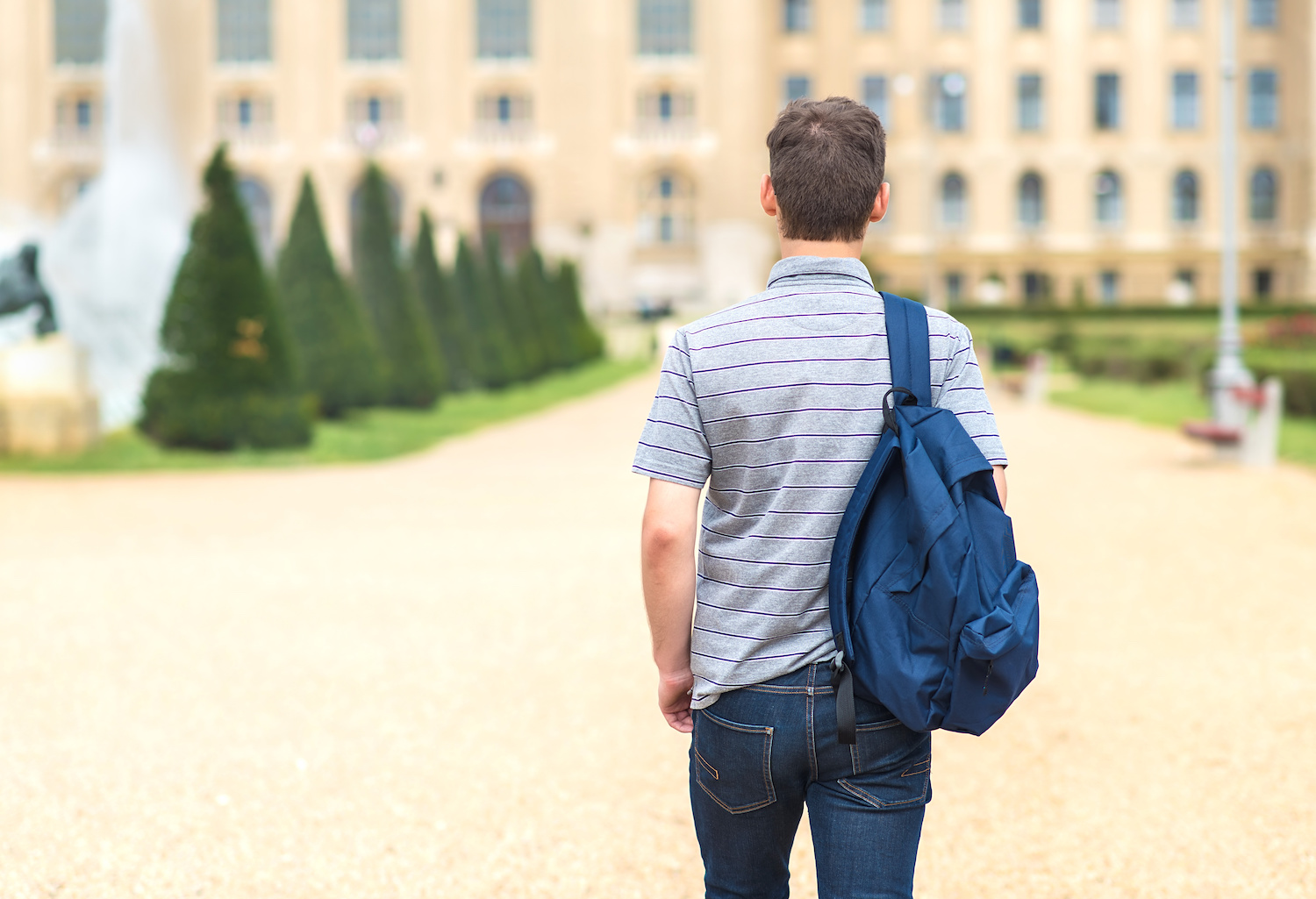 student walking in college campus