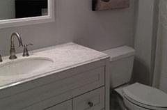 After: Bathroom with updated fixtures and modern color scheme
