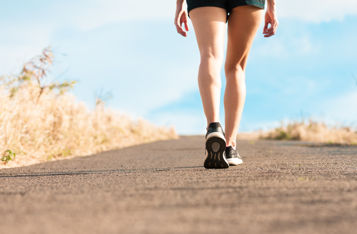 person walking on trail