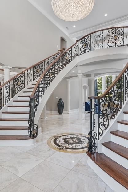 Double staircases with marble flooring