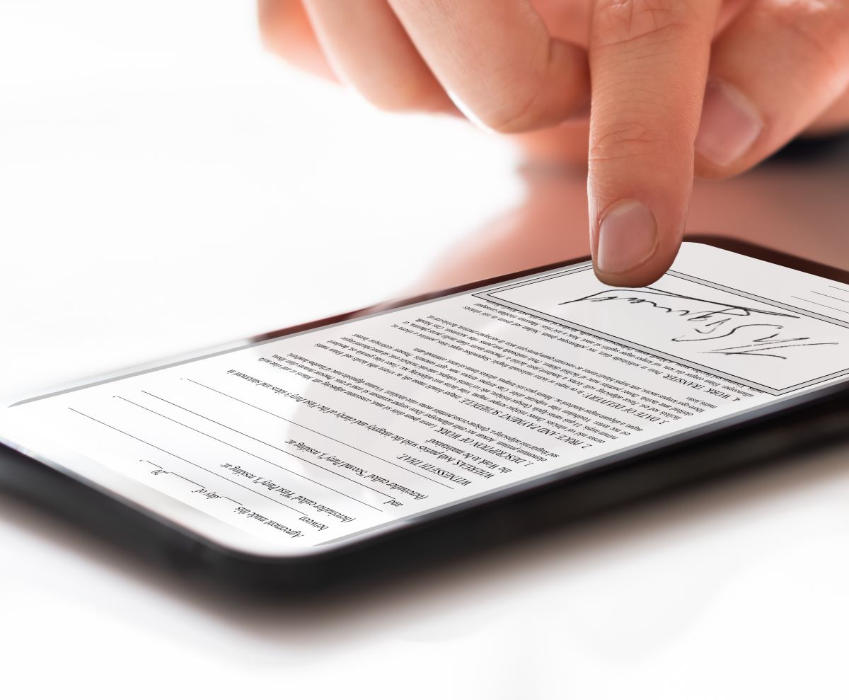 person signing documents in phone