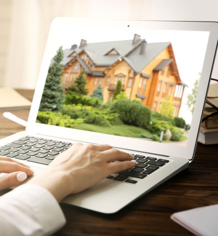 woman seeing a house listing in computer